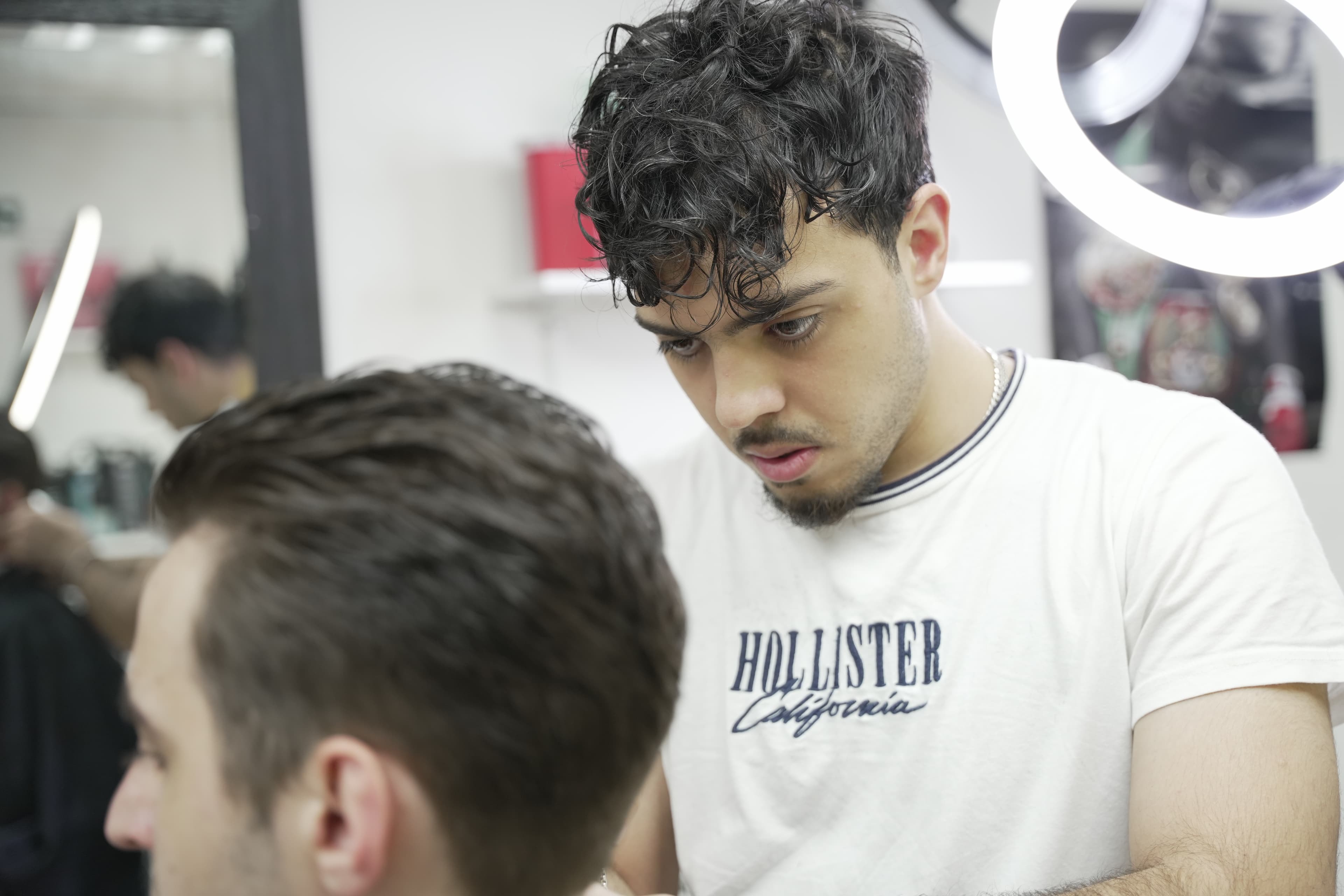 Eraj, barber at OutKasts Barbershop