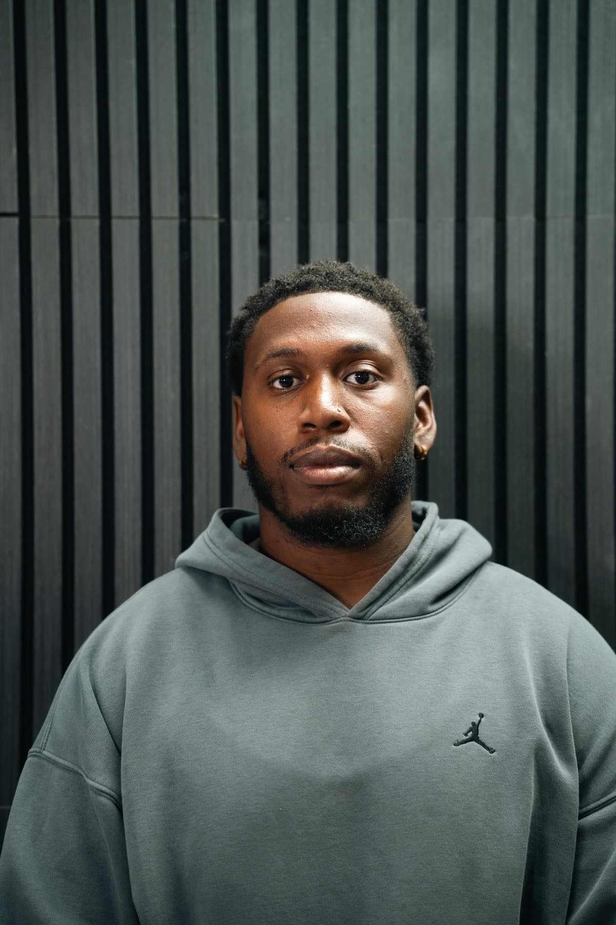 Kenzo, barber at OutKasts Barbershop